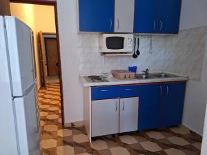 Kuchyňa alebo kuchynka v ubytovaní Apartments Sor