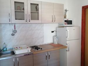 Kuchyňa alebo kuchynka v ubytovaní Apartments Sor + 37 fotografií