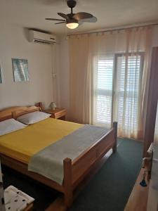 Posteľ alebo postele v izbe v ubytovaní Apartments Sonja