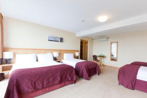 Voodi või voodid majutusasutuse Upton Court Hotel toas