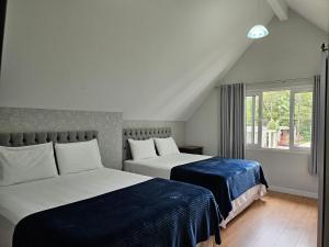 Postel nebo postele na pokoji v ubytování Pousada Behling Haus