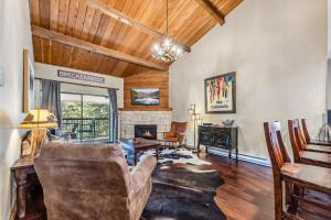 a living room with a couch and a fireplace at Rocky Mountain Mama in Breckenridge