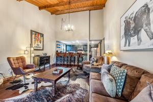 a living room with a couch and a table at Rocky Mountain Mama in Breckenridge +20 photos