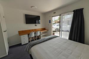 Postel nebo postele na pokoji v ubytování Marton Motel NZ