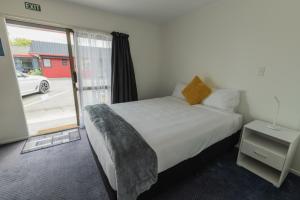 Postel nebo postele na pokoji v ubytování Marton Motel NZ