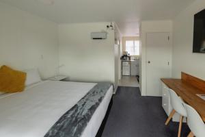 Postel nebo postele na pokoji v ubytování Marton Motel NZ