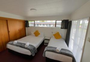 Postel nebo postele na pokoji v ubytování Marton Motel NZ
