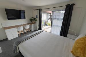 Postel nebo postele na pokoji v ubytování Marton Motel NZ