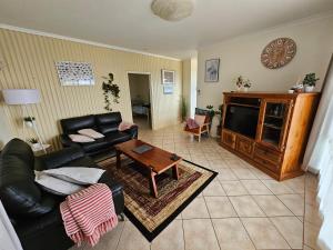 a living room with a couch and a table at Home and Hound Kendenup in Kendenup