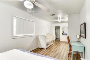 a bedroom with a bed and a desk and a table at River Frontage Quiet Mississippi Vacation Rental in McComb