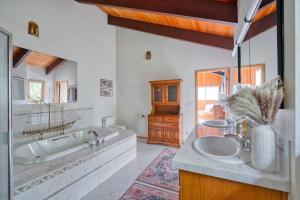 a bathroom with two sinks and a large mirror at The Lodge at Highland Farms in Brightwood +24 photos