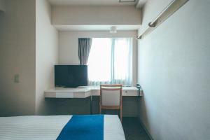 TV o dispositivi per l'intrattenimento presso Hamilton Hotel Blue