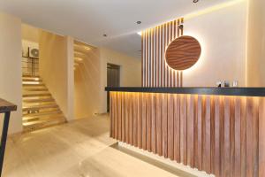 a lobby with a bar and a staircase at Stunning 2BR with Plunge Pool - Rooftop Sea Views in Playa del Carmen