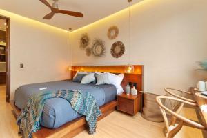 a bedroom with a bed and a ceiling fan at Stunning 2BR with Plunge Pool - Rooftop Sea Views in Playa del Carmen +37 photos