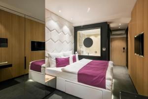Postel nebo postele na pokoji v ubytování Pytloun Grand Hotel Imperial