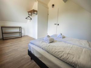 Postel nebo postele na pokoji v ubytování Detached holiday home near Nijmegen