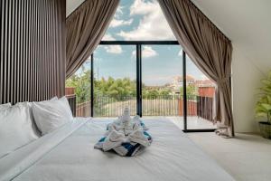 Ένα ή περισσότερα κρεβάτια σε δωμάτιο στο Six Stars Townhouse A2 Brand New 2 Bedroom in Canggu +24 φωτογραφίες