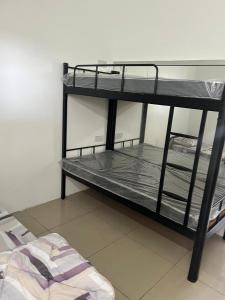 a room with two bunk beds in a room at Hostel TTDI in Shah Alam