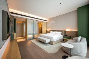 Qinglian Jinghe Hotel Wuhan Zoo International Expo Center Branch客房内的一张或多张床位
