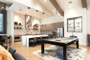 a kitchen with a ping pong table in a room at Overlook 3111 Modern Luxury In Heart Of Knoxville in Knoxville