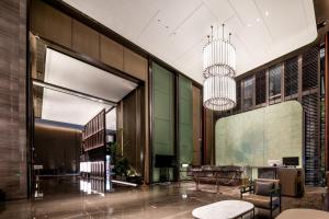 Qinglian Jinghe Hotel Wuhan Zoo International Expo Center Branch的休息区