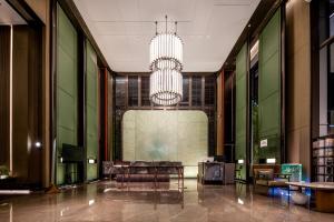 Qinglian Jinghe Hotel Wuhan Zoo International Expo Center Branch的休息区