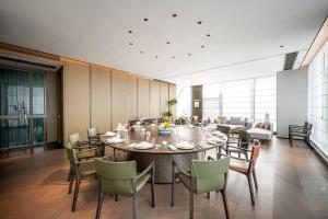 Qinglian Jinghe Hotel Wuhan Zoo International Expo Center Branch的休息区