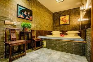 Katil atau katil-katil dalam bilik di Pingyao Grand Theater Guild Hall East Garden