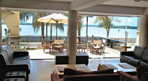 a living room with a view of the water at Costarenas Hotel & Spa in Colón