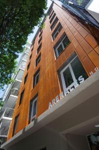 a tall building with a sign on the side of it at Hotel Arenales in Buenos Aires