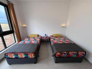 Letto o letti in una camera di J'Vais Residence by SOV