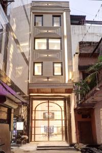 a tall building with a door in front of it at Hotel Namaste Hindustan Just a Minute Away From New Delhi Railway Station and Connaught place in New Delhi
