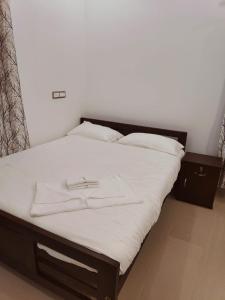 Postel nebo postele na pokoji v ubytování Palm Paradise Home Stay