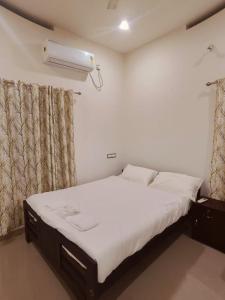 Postel nebo postele na pokoji v ubytování Palm Paradise Home Stay
