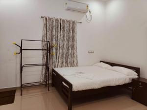 Postel nebo postele na pokoji v ubytování Palm Paradise Home Stay