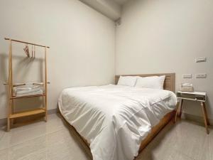 Postel nebo postele na pokoji v ubytování Apple Homestay