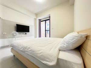 Postel nebo postele na pokoji v ubytování Apple Homestay