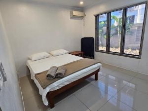 Postel nebo postele na pokoji v ubytování FIJI HOME Apartment Hotel + 37 fotografií