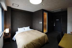 Postel nebo postele na pokoji v ubytování Hotel Chino