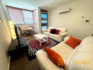 Ένα ή περισσότερα κρεβάτια σε δωμάτιο στο Pretty Penthouse - Close to ANU +10 φωτογραφίες