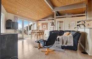 a living room with two chairs and a table at Stunning Home In Vestervig With Sauna in Vestervig