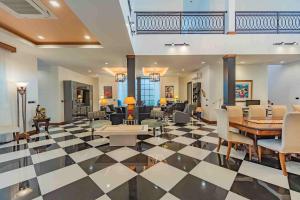a living room with a black and white checkered floor at Villa Viola 7 Bedroom, Fully Staffed, on the Golf Course in Laguna Phuket