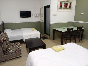 Ein Bett oder Betten in einem Zimmer der Unterkunft Hotel Seri Intan Tampin