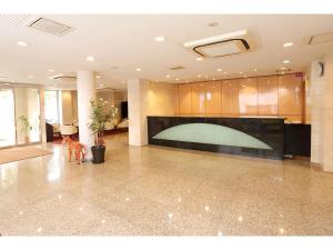a large lobby with a large screen in a building at Smile Hotel Nara in Nara