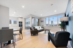 a living room with a couch and chairs at Modern 2 Bed Heart of Elephant Castle in London