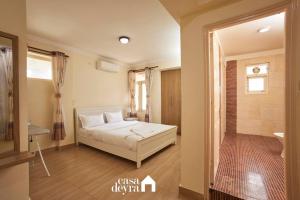 Ένα ή περισσότερα κρεβάτια σε δωμάτιο στο Blissful Haven 1BHK Penthouse