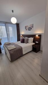 A bed or beds in a room at International Atene hotel