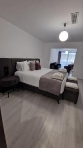 A bed or beds in a room at International Atene hotel