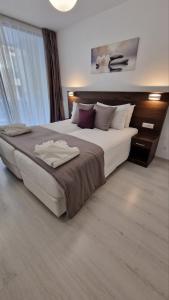 A bed or beds in a room at International Atene hotel