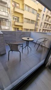 A balcony or terrace at International Atene hotel